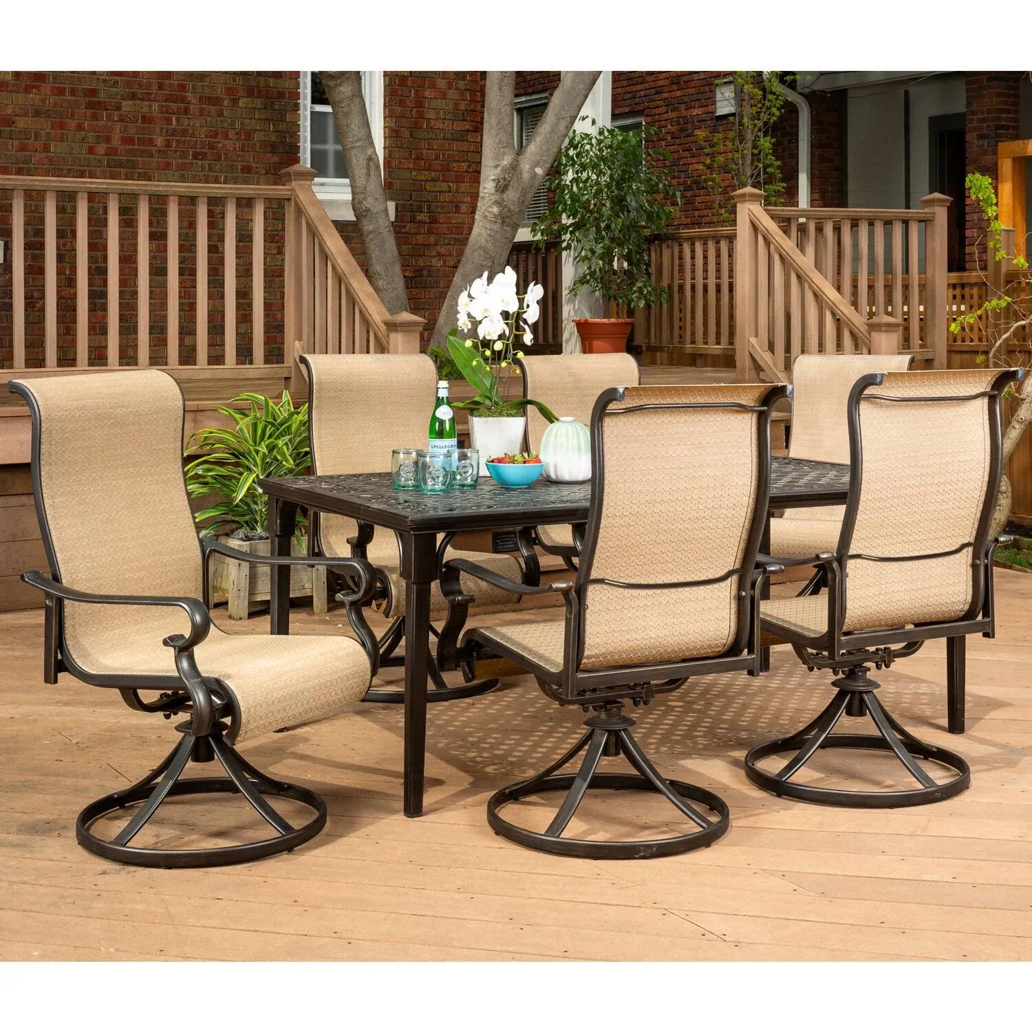 Hanover Brigantine 7-Piece Dining Set with A 40" x 70" Cast-Top Dining Table and 6 Sling Swivel Rockers